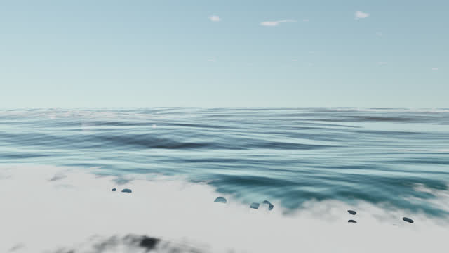 Spent waves rush up the sand, foaming and churning.